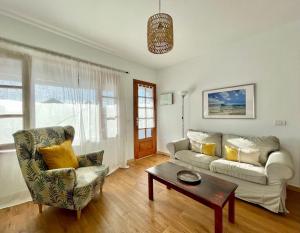 a living room with a couch and a table at O sole mio en Playa honda in Playa Honda