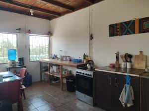 a kitchen with a stove and a counter top at Guest House Villa Machalilla in Machalilla