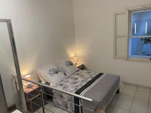 Ένα ή περισσότερα κρεβάτια σε δωμάτιο στο Le Lézard Vert - Lagon