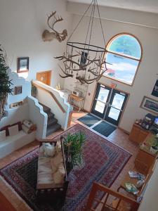 an aerial view of a living room with a chandelier at White Birch Inn in Sturgeon Bay