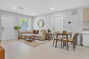 a living room with a couch and a table at Sistrunk Shades Villas #5 - Brand New Townhomes in Downtown Fort Lauderdale in Fort Lauderdale