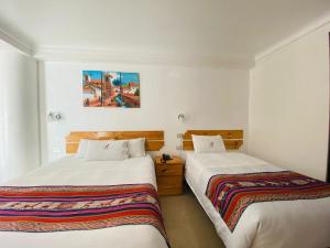 Ein Bett oder Betten in einem Zimmer der Unterkunft Vista Machu Picchu