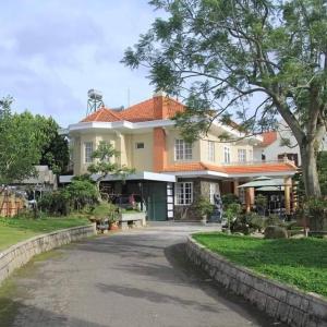 a large house with a road in front of it at BACH TÙNG Garden Village in Xuan An
