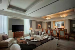 a living room with a couch and a table at JW Marriott Kuala Lumpur - TravelEase Visa-Free Getaway in Kuala Lumpur