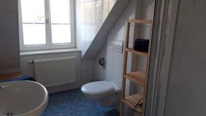 Koupelna v ubytování Wohnung Weeto + 8 fotografií