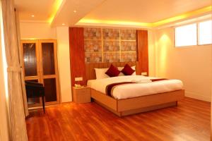 Voodi või voodid majutusasutuse Hotel Elegant Kathmandu Inn toas