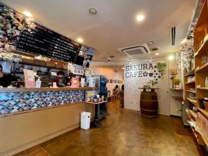 a fast food restaurant with a counter and a counter at Sakura Hotel Ikebukuro in Tokyo