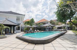 an image of a swimming pool at a resort at Casa Wina Kuta by The Wina Resorts in Kuta