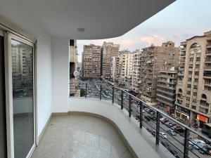 a balcony with a view of a city at Queen plaza Nasr City in Cairo
