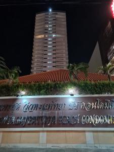 a sign in front of a tall building at night at Walking Street side View Talay 6 Pattaya in Pattaya Central