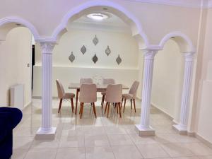 a dining room with a table and chairs at Great location apartment in Amman