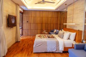 Postel nebo postele na pokoji v ubytování Sana Vie Villa Seminyak by Ini Vie Hospitality