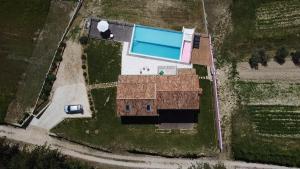 an aerial view of a house with a swimming pool at Villa San Silvestro in Oprtalj
