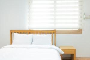 Postel nebo postele na pokoji v ubytování Ocean Palade Hotel
