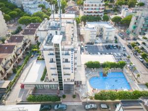 an aerial view of a city with a swimming pool at Hotel de Paris in Lido di Savio