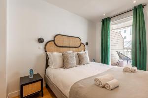 Postel nebo postele na pokoji v ubytování Sweett - Le Montmartre