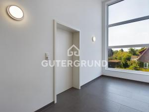 a room with a large window on thefourth floor at Studio-Apartment "Charlotte" in Westerstede
