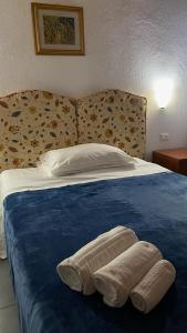 Llit o llits en una habitació de Locanda le GINESTRE