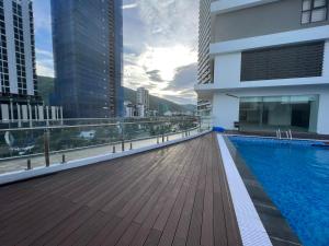 a balcony with a swimming pool on top of a building at FLC Sea Tower Condotel in Quy Nhon