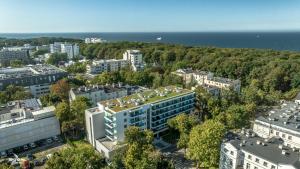 an aerial view of a city with buildings and the ocean at Whiteblue apartamenty Kołobrzeg in Kołobrzeg