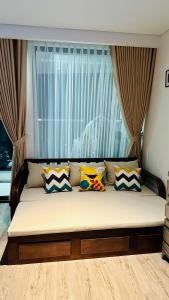 מיטה או מיטות בחדר ב-Apec Mandala Phú Yên View Biển