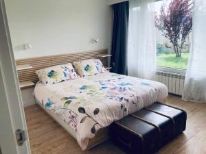 a bedroom with a bed and a window at El Cabezuelo in Ávila