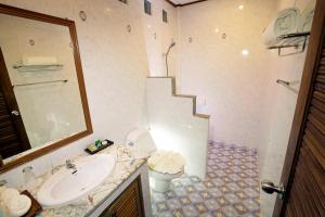a bathroom with a sink and a toilet at Smile House - Fisherman Village in Bophut