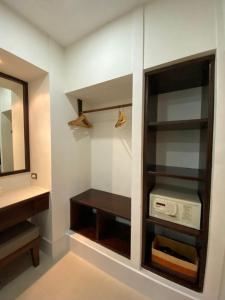 a bathroom with a sink and a mirror at Smile House - Fisherman Village in Bophut