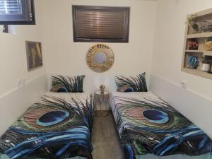 a room with two beds in a room at Апартамемт 3 места с кухня с дворче in Vratsa