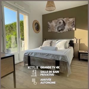 Кровать или кровати в номере Chambre Sérénité dans maison au calme