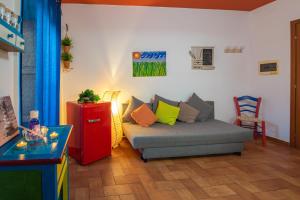 Area soggiorno di Favolosa Casa Vacanza a Cefalù