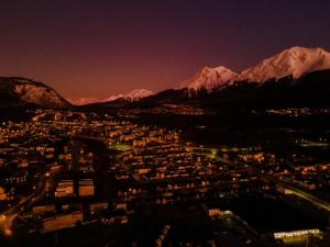 a view of a city with snow capped mountains at Hotel Campanilla in Ushuaia