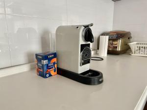 a coffee maker and a box on a kitchen counter at Spacious 140m2, 2 bedrooms apartment in Ulaanbaatar