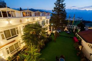 an aerial view of a building with a green yard at Little Tibet in Darjeeling