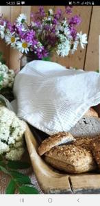 a group of bread sitting on a table with flowers at Søberget in Stange