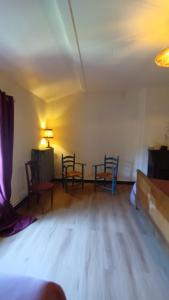 a room with chairs and a table in a room at MAISON ALETEIA*** DECOUVERTE ET SERENITE in Alet-les-Bains