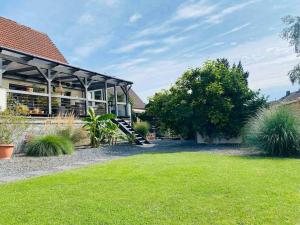 a house with a playground in the yard at Pool, Sauna und Blick ins Grüne in Lutherstadt Wittenberg