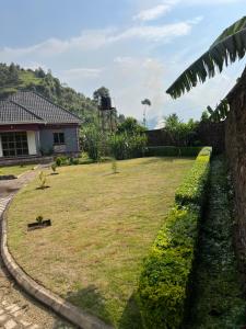 a yard in front of a house at Pearl Sanctuary 02_Kisoro Homestay in Kisoro