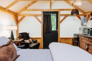 a room with a bed and a living room at The Preserve Battenkill River in Cambridge