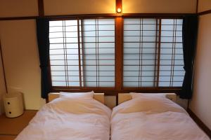 A bed or beds in a room at Hostel Fish in a River