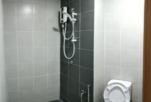 a shower stall with a toilet in a bathroom at Afnan Homestay at Semenyih, Ascotte Boulevard in Semenyih