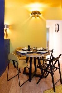 a dining room with a table and chairs at Knightstone Apartment in Weston-super-Mare