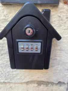 a black object on the side of a wall at Valletta Private Room in Valletta