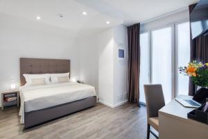 Posteľ alebo postele v izbe v ubytovaní Hotel Studio Inn Centrale & Milano Urban Padel