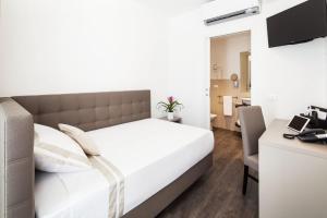 Katil atau katil-katil dalam bilik di Hotel Studio Inn Centrale & Milano Urban Padel