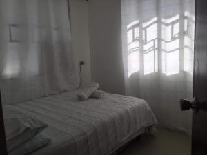 Rúm í herbergi á Cebu 2 Bedrooms House -WIFI