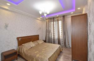Postel nebo postele na pokoji v ubytování Yerevan Guest House