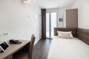 Posteľ alebo postele v izbe v ubytovaní Hotel Studio Inn Centrale & Milano Urban Padel