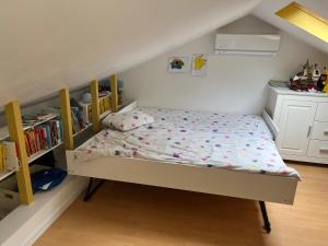 Кровать или кровати в номере La Belle au Bois Dormant - JO2024