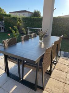 a blue table and chairs on a patio at Proche Saint Rémy de Provence in Mollégès